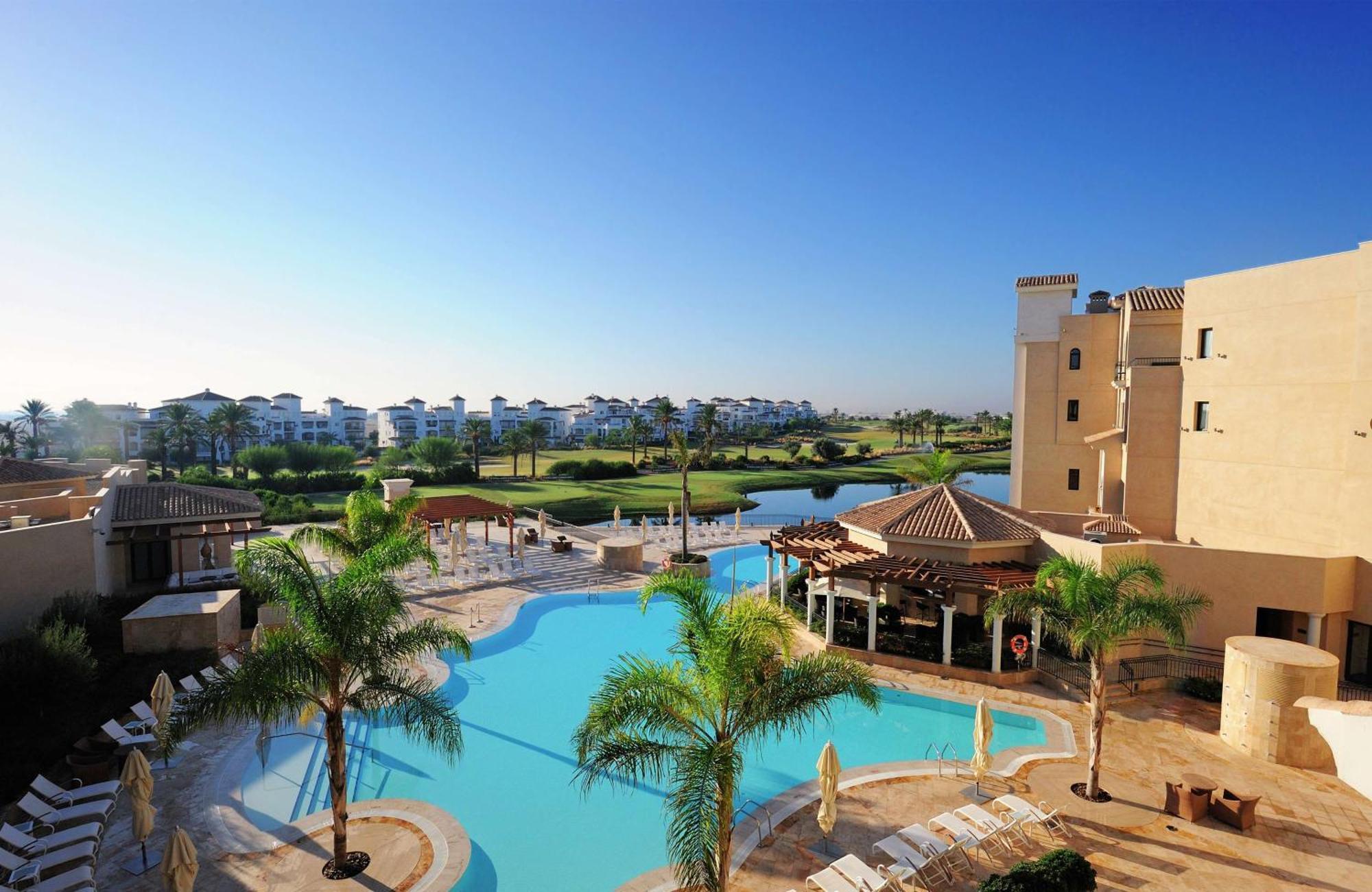Doubletree By Hilton La Torre Golf Resort Рольдан Экстерьер фото View of the pool at the clubhouse